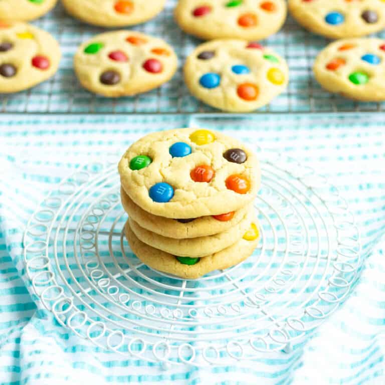 Copycat Mrs. Fields Sugar Butter cookies on a small white grid with cookies in the background