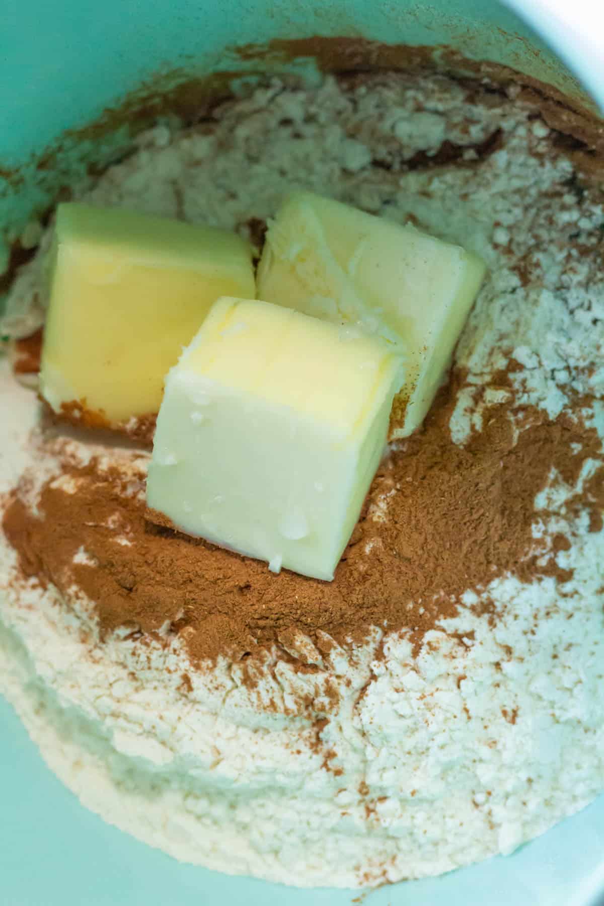 Butter, flour, cinnamon and water in a mixing bowl