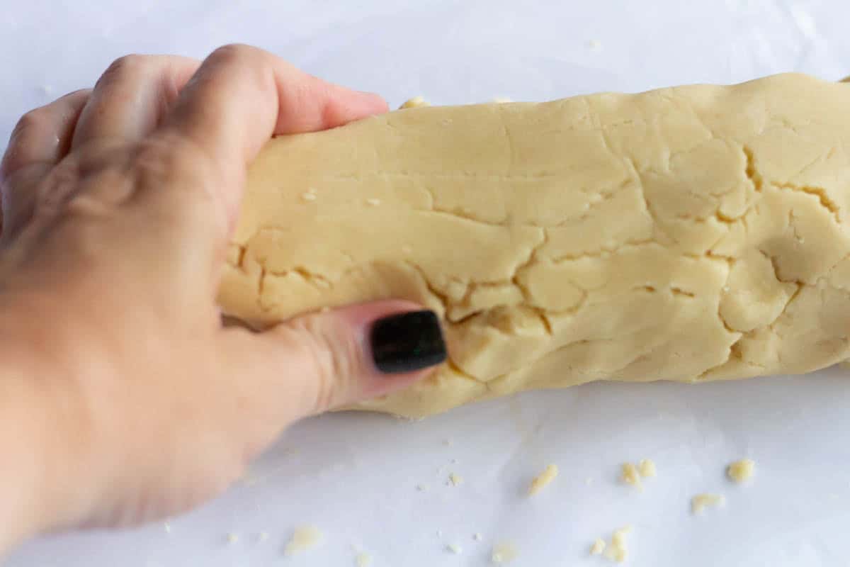 Old-Fashioned Butter Cookie Recipe | thewendthousekitchen.com Molding dough together with hand.