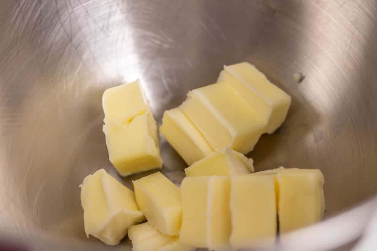 Cubed butter in the bowl of a stand mixer