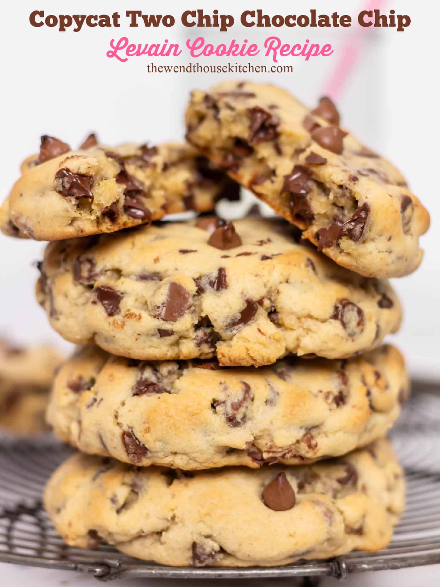 Four stacked chocolate chip cookies with the top cookie broken in half. The photo is labeled at the top