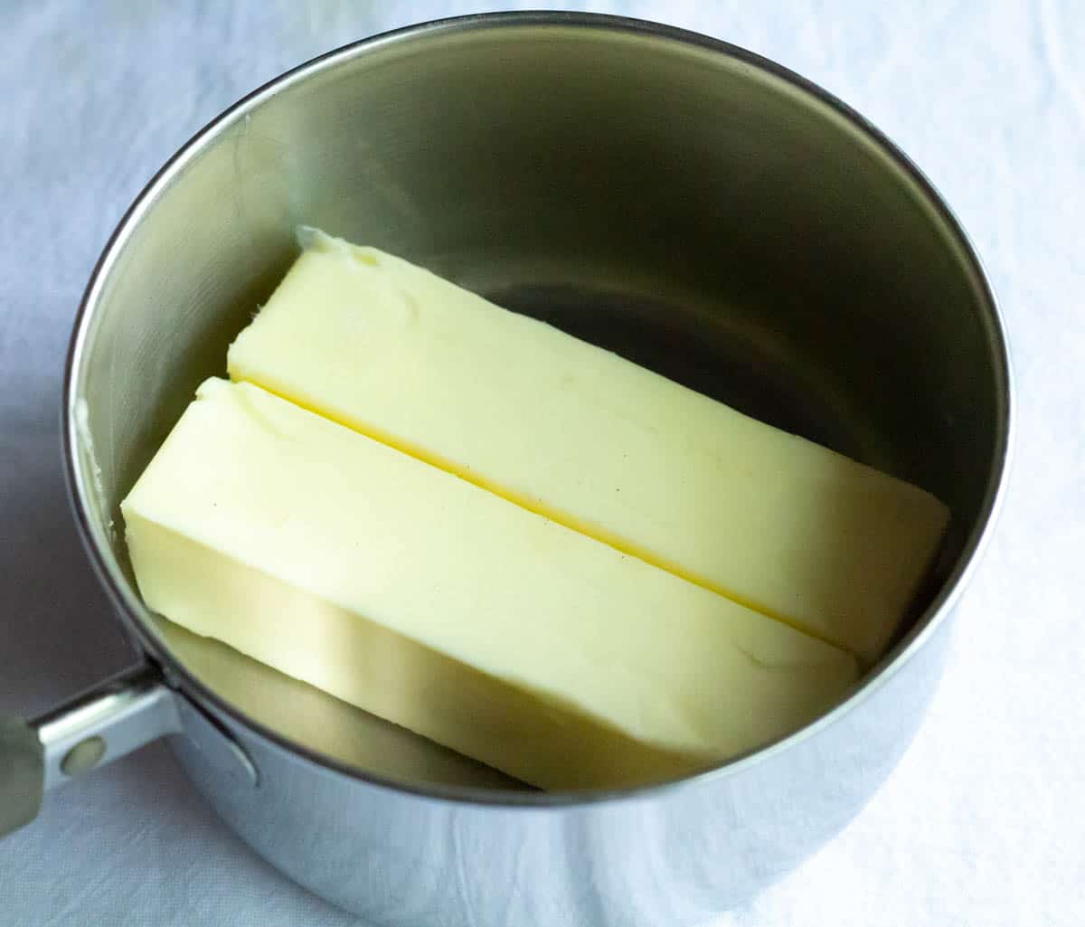 Two sticks of butter in a medium saucepan