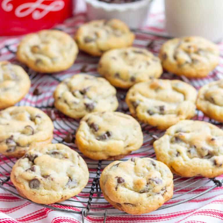 Baked chocolate chip cookies on a wire cooling grid
