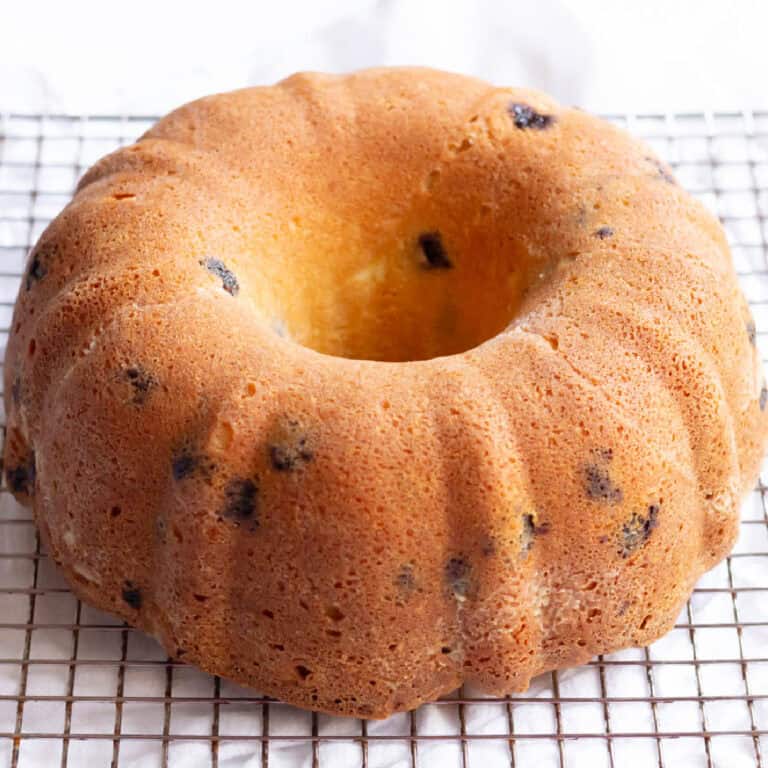A Bundt cake cooling on a cooling grid