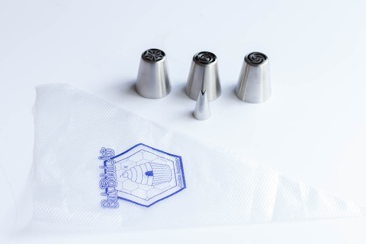 Three Russian piping tips, a tip #352 leaf tip and a 16-inch disposable piping bag