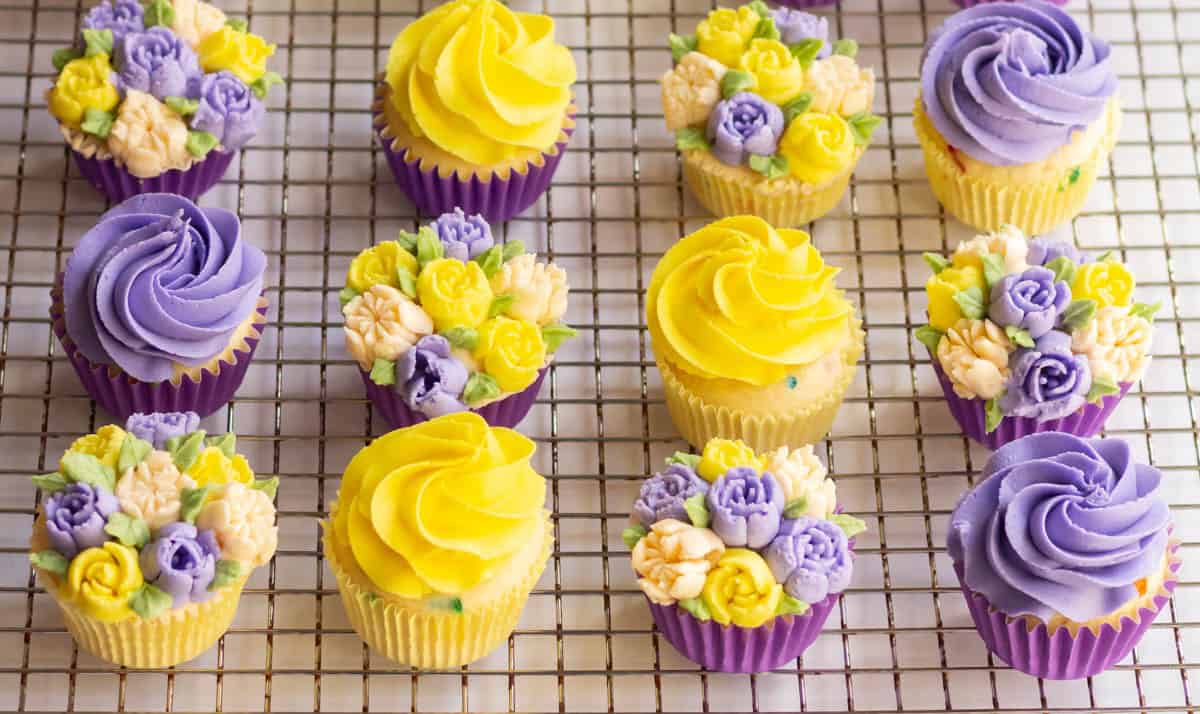 Lavender and yellow buttercream cupcakes with swirls and flowers