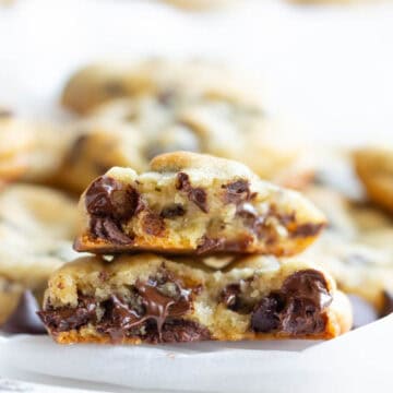 A melty chocolate chip cookie broken in half