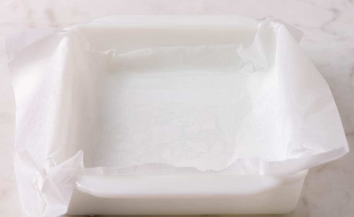 Carmelitas Dessert Bars | thewendthousekitchen.com Parchment-lined 8x8-inch baking dish