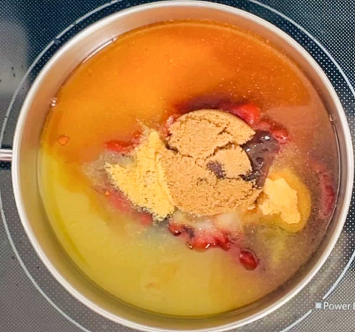 Ingredients for bbq sauce in a medium saucepan