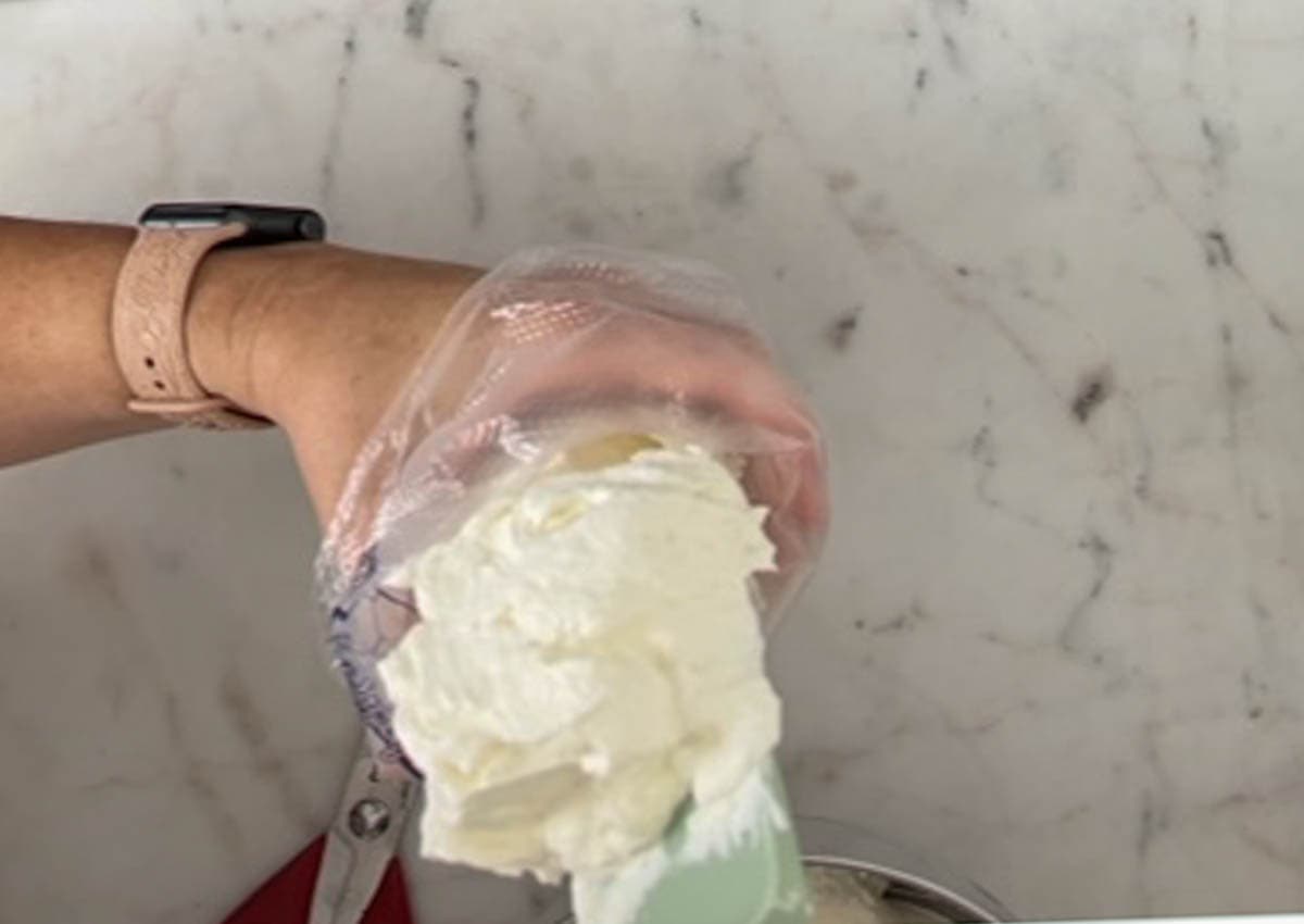 Filling a pastry bag with whipped cream