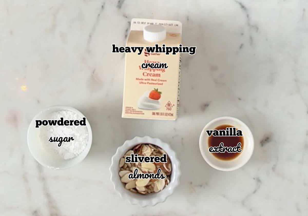 Ingredients for whipped cream in individual bowls and labeled