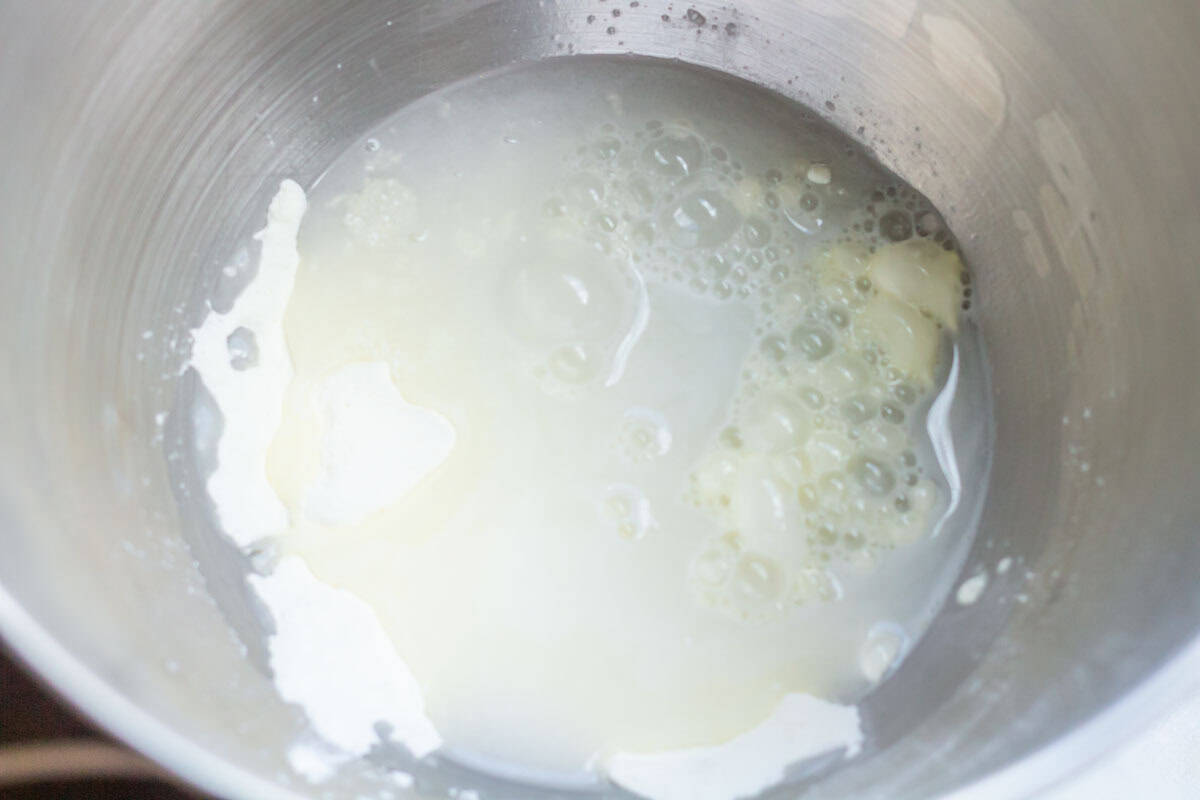 Royal Icing Recipe with Meringue Powder | thewendthousekitchen.com Warm water and meringue powder in the bowl of a stand mixer.