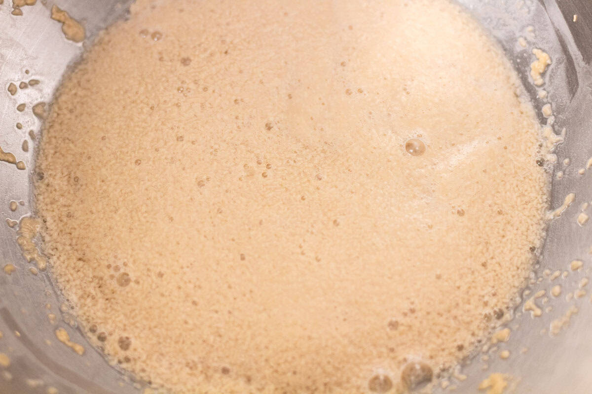 Sour Dough Discard Cinnamon Rolls | thewendthousekitchen.com Bloomed yeast in water in the bowl of a stand mixer.