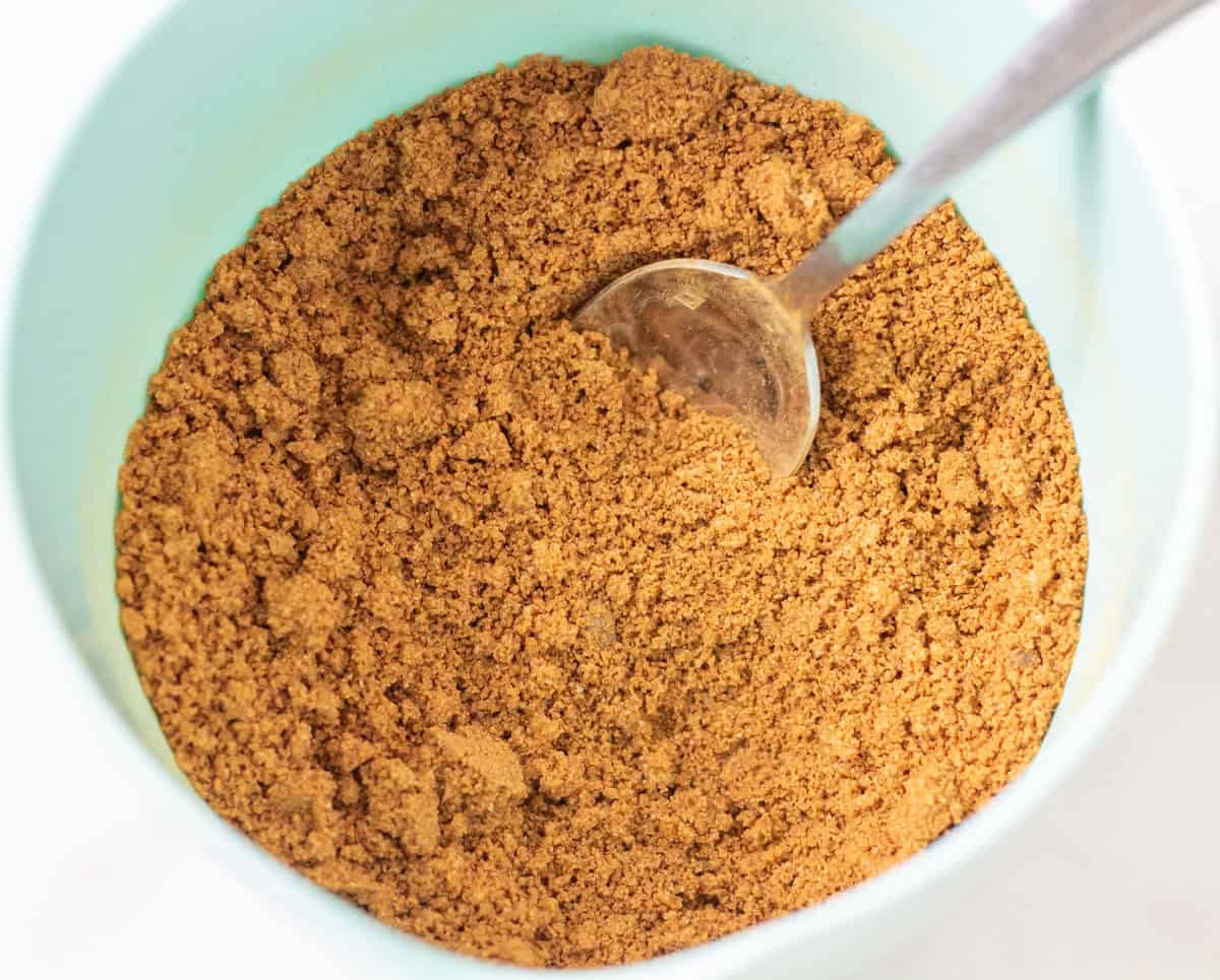 Sour Dough Discard Cinnamon Rolls | thewendthousekitchen.com Cinnamon roll filling combined in a bowl with a spoon.