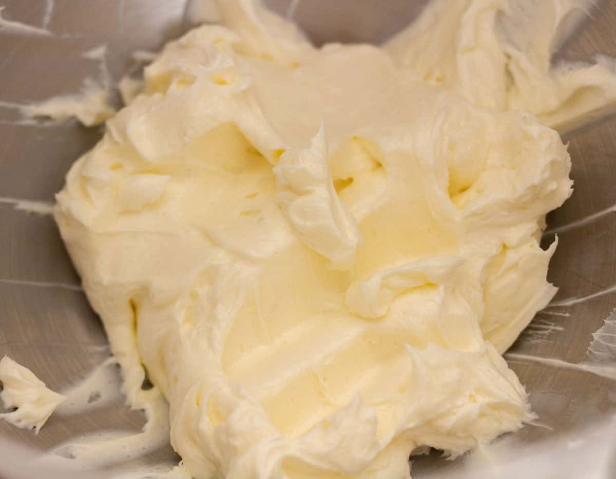 Sour Dough Discard Cinnamon Rolls | thewendthousekitchen.com Butter and cream cheese blended together inside the bowl of a stand mixer.