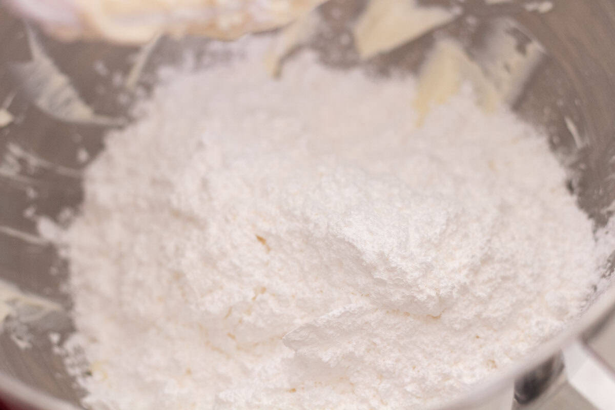 Sour Dough Discard Cinnamon Rolls | thewendthousekitchen.com Powdered sugar, heavy cream and vanilla extract added to the bowl with the butter and cream cheese.