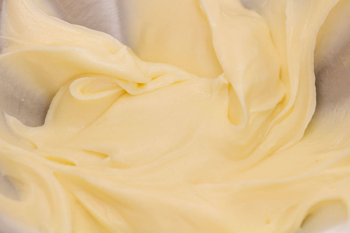 Sour Dough Discard Cinnamon Rolls | thewendthousekitchen.com Cream cheese icing in the bowl of a stand mixer.