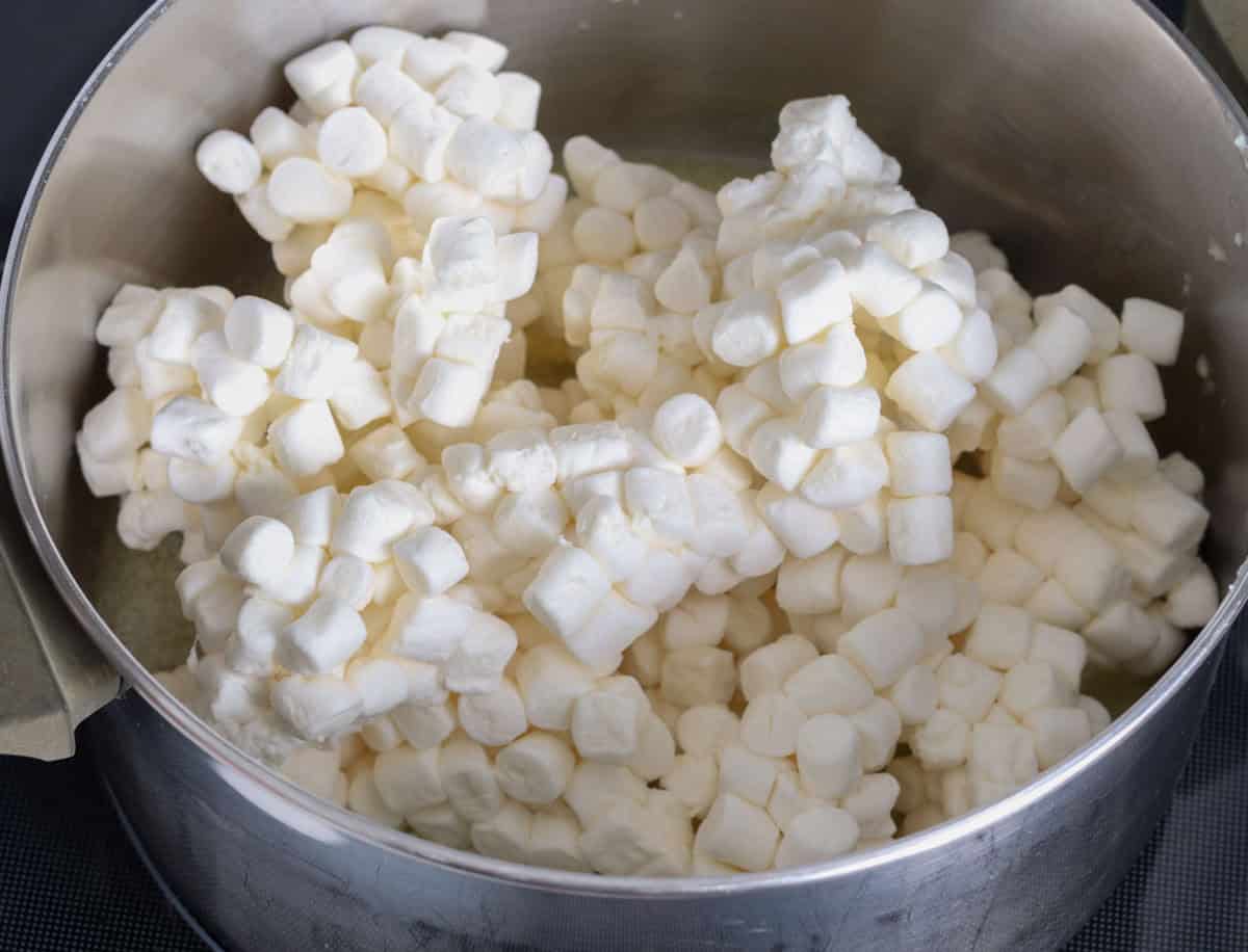 Lucky Charm Krispie Treats | thewendthousekitchen.com Marshmallows added to a large saucepan.