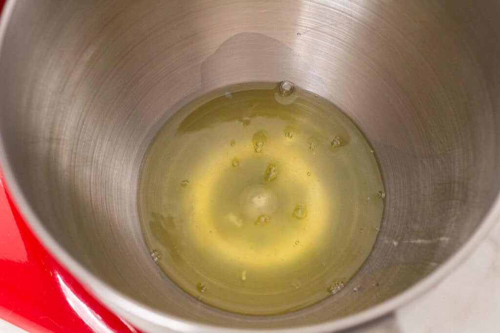 How To Make Italian Meringue Buttercream | thewendthousekitchen.com Egg whites inside of a bowl of a stand mixer.