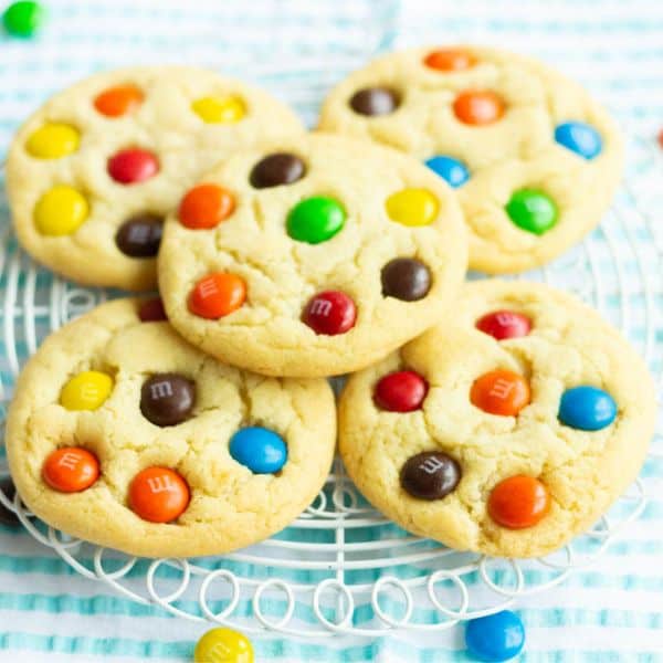 Sugar Butter M&M Cookies on a white round grid.
