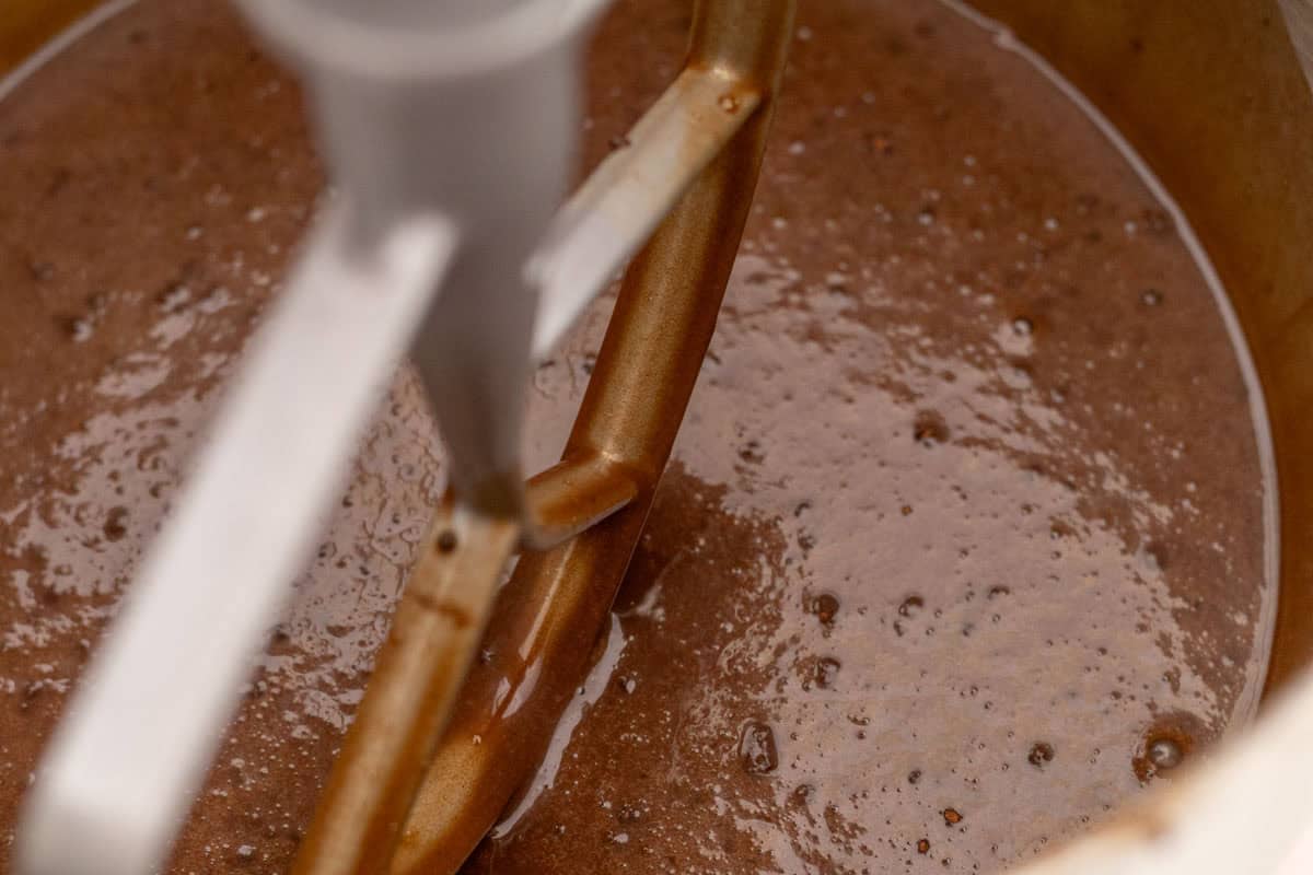 Chocolate Mint Cake with Mint Cream Cheese Frosting | thewendthousekitchen.com Chocolate cake batter in the bowl of a stand mixer with a paddle attachment.