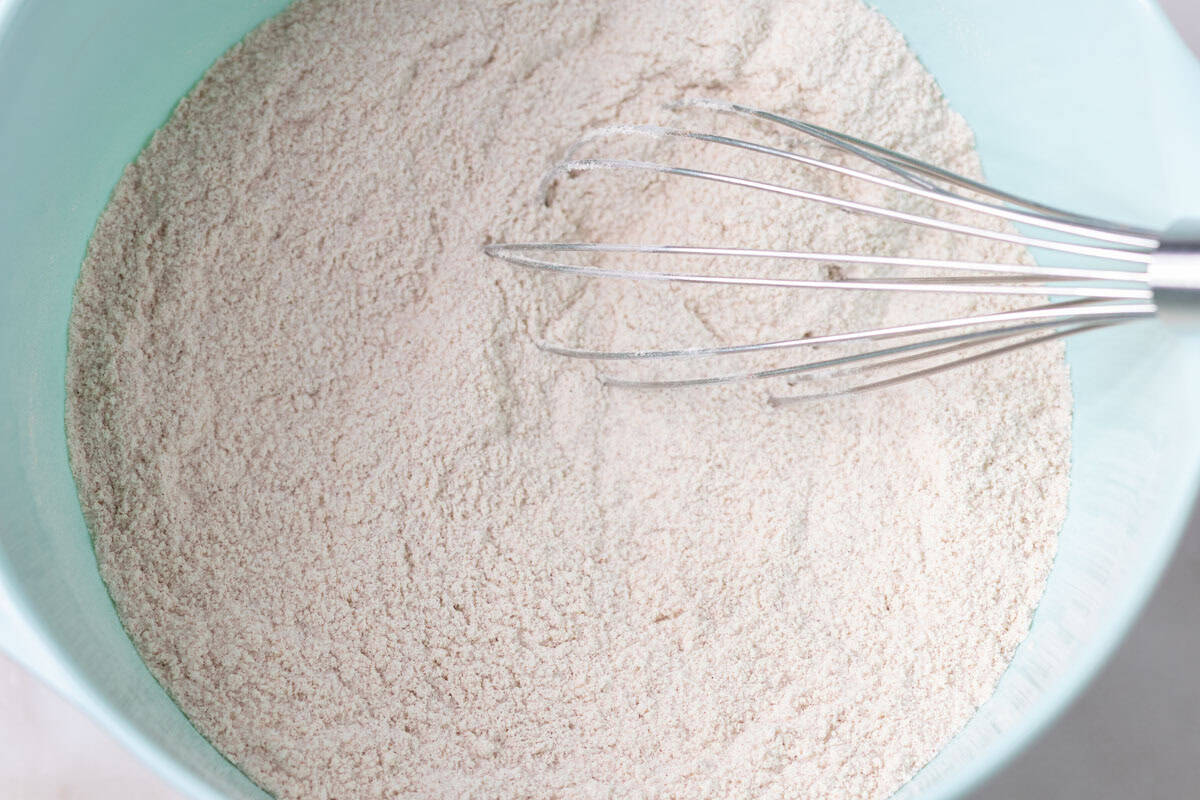 Carrot Cake Loaf Cake | thewendthousekitchen.com Flour, sugar, cinnamon, baking soda and salt combined together in a large mixing bowl.