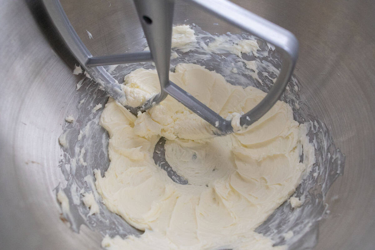 Carrot Cake Loaf Cake | thewendthousekitchen.com Cream cheese and butter in the bowl of a stand mixer combined together with a padle attachment.