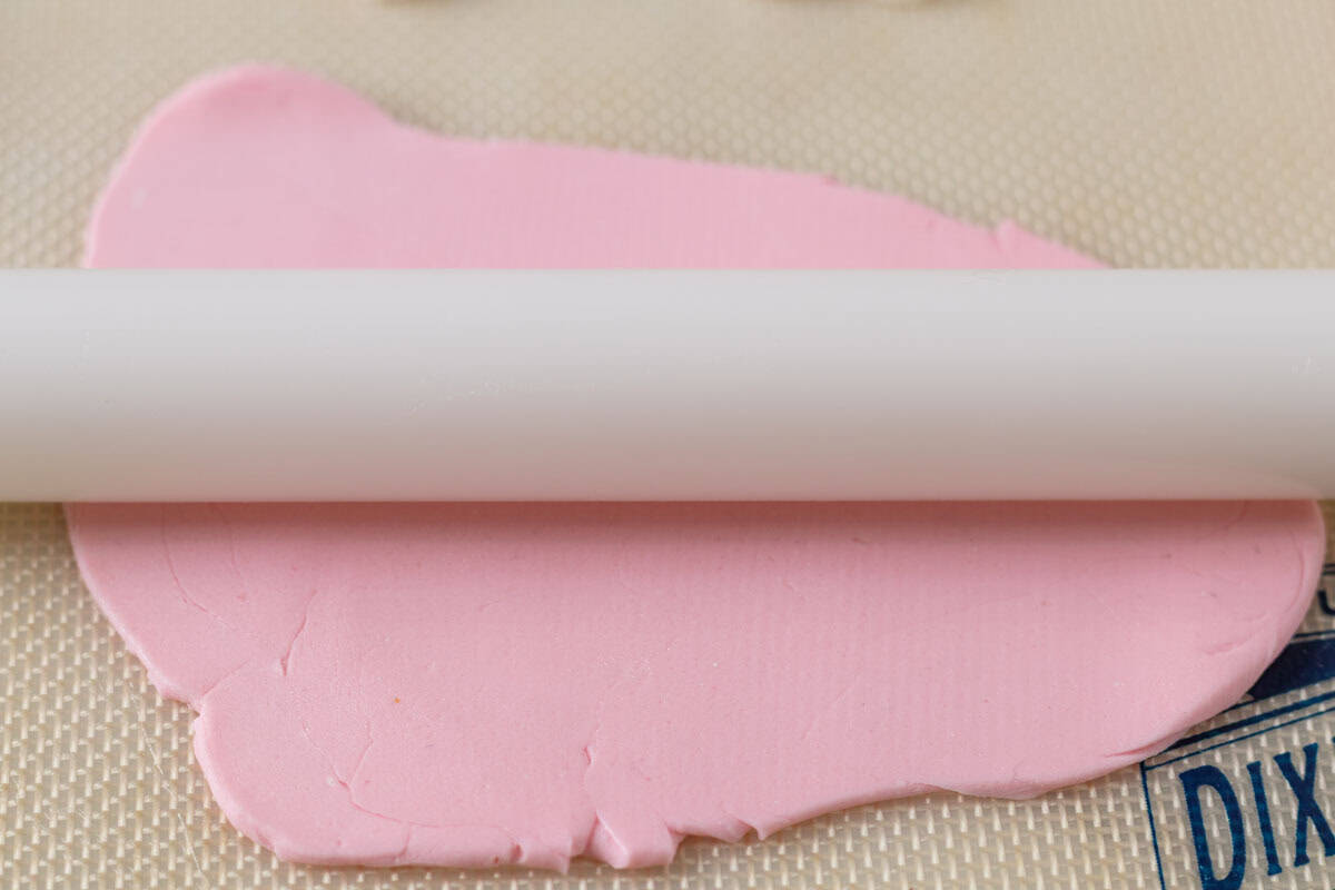 Bunny Cupcakes for Easter (Bunny Butt Cupcakes) | thewendthousekitchen.com Rolling our pink fondant with a small rolling pin.
