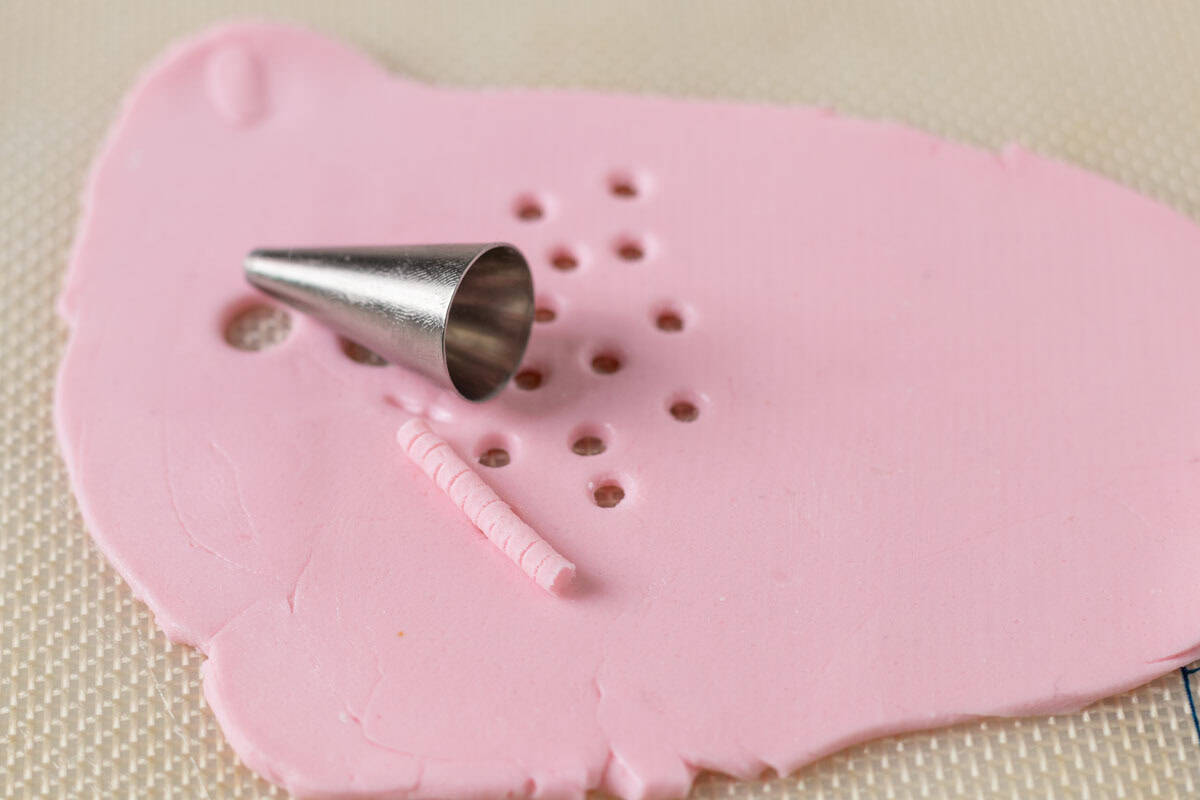 Bunny Cupcakes for Easter (Bunny Butt Cupcakes) | thewendthousekitchen.com A piping tip size 5 on top of pink fondant with circles cut out.