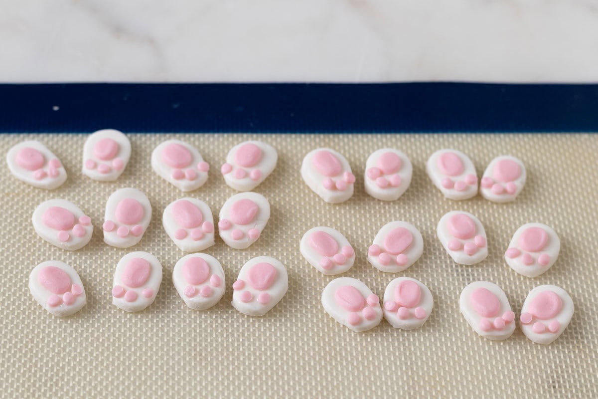 Bunny Cupcakes for Easter (Bunny Butt Cupcakes) | thewendthousekitche.com 12 completed bunny pads on a Silpat mat.