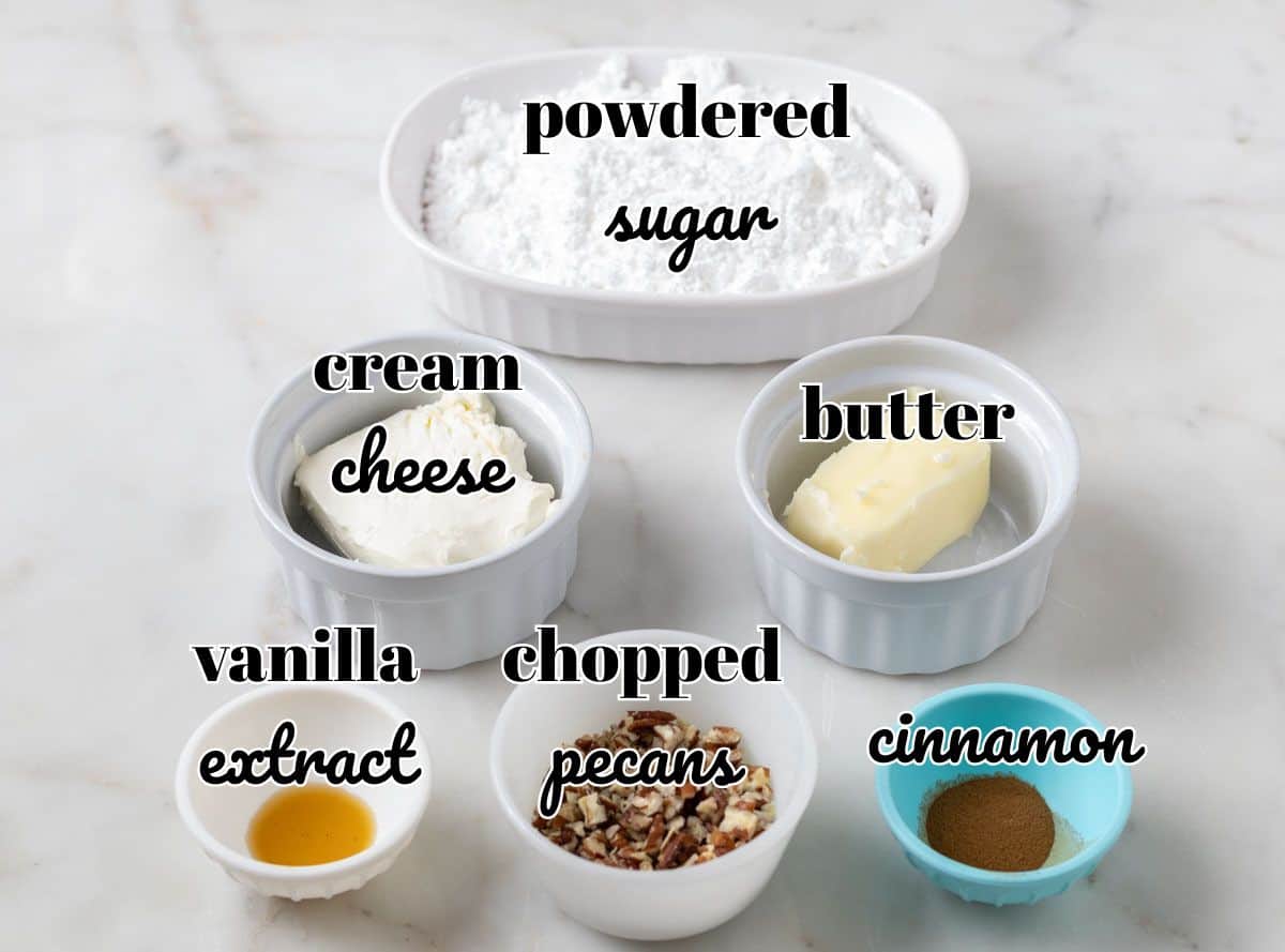 Carrot Cake Loaf Cake | thewendthousekitchen.com Ingredients for cream cheese frosting in individual bowls and labeled.