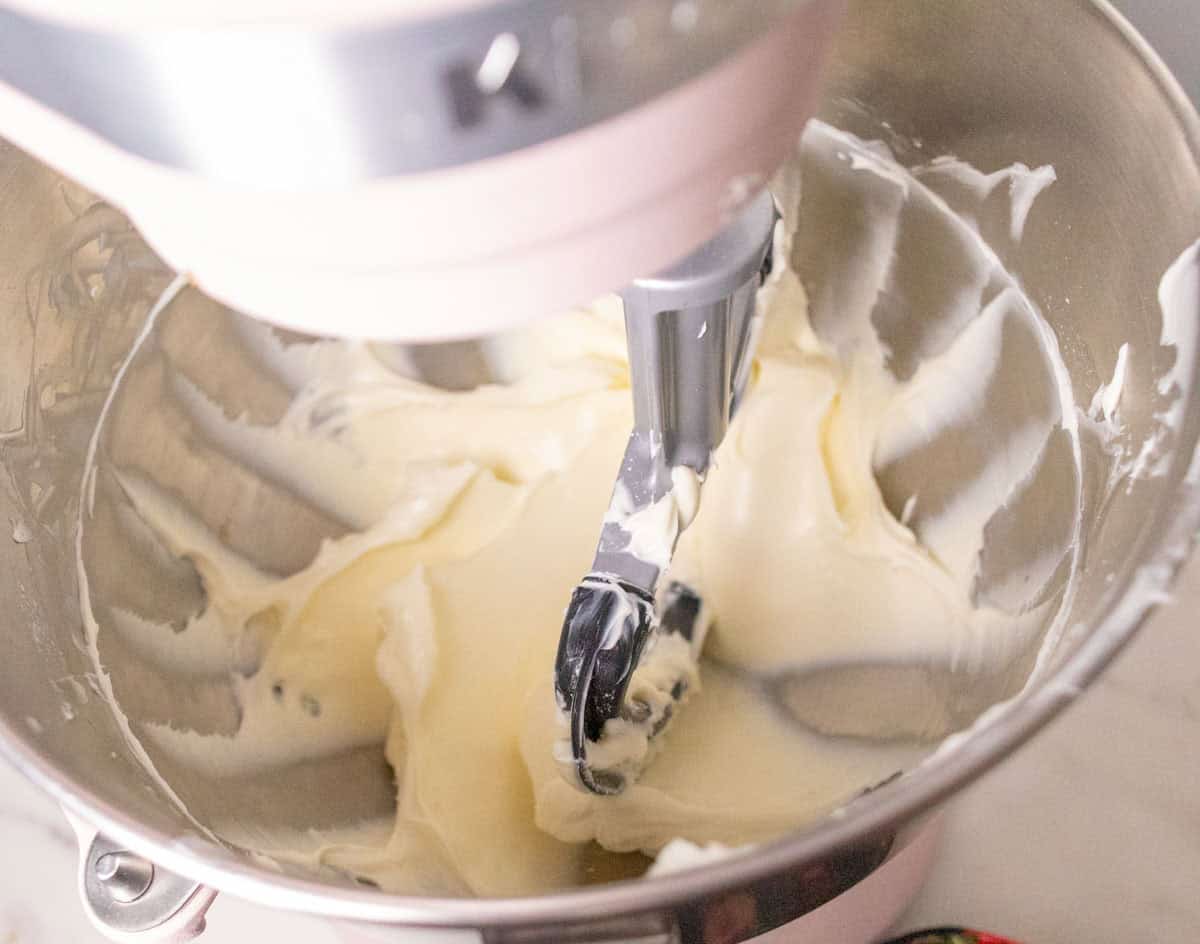 3 Ingredient No Bake Cheesecake | thewendthousekitchen.com Cream cheese and powdered sugar combined and smooth in the bowl of a stand mixer with a paddle attachment.