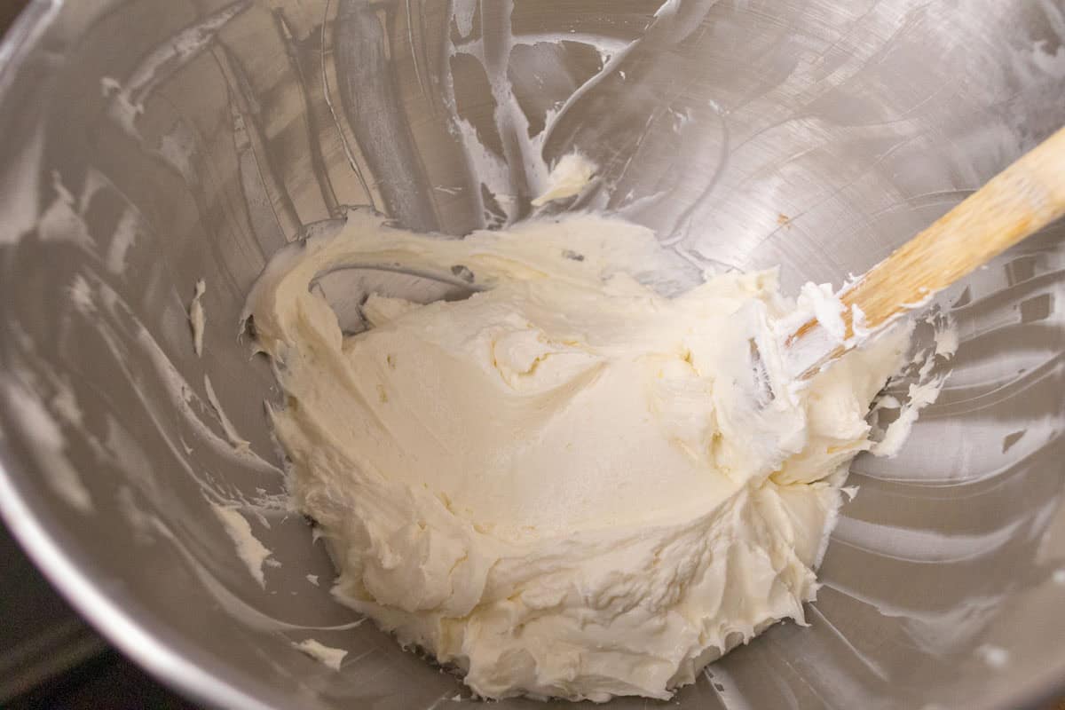 3 Ingredient No Bake Cheesecake | thewendthousekitchen.com Cool Whip topping, cream cheese and powdered sugar mixed together in the bowl of a stand mixer.l