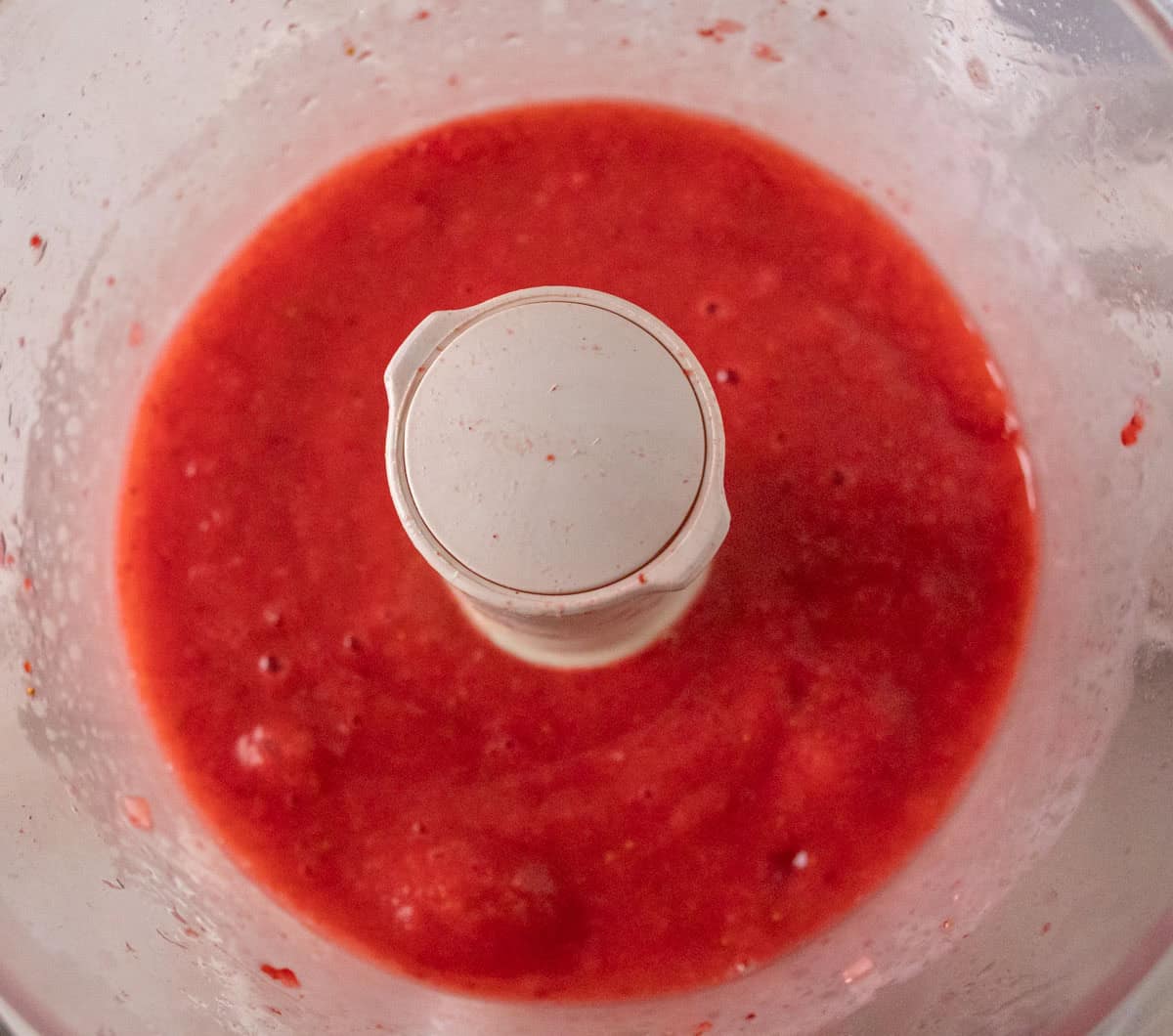 Strawberry Crunch Cake | thewendthousekitchen.com Puréed strawberries in a food processor.