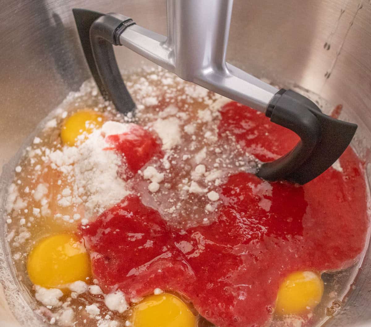 Strawberry Crunch Cake | thewendthousekitchen.com Cake mix, vegetable oil, all-purpose flour, Jello mix, water, eggs and strawberry purée added to the bowl of a stand mixer with a paddle attachment.