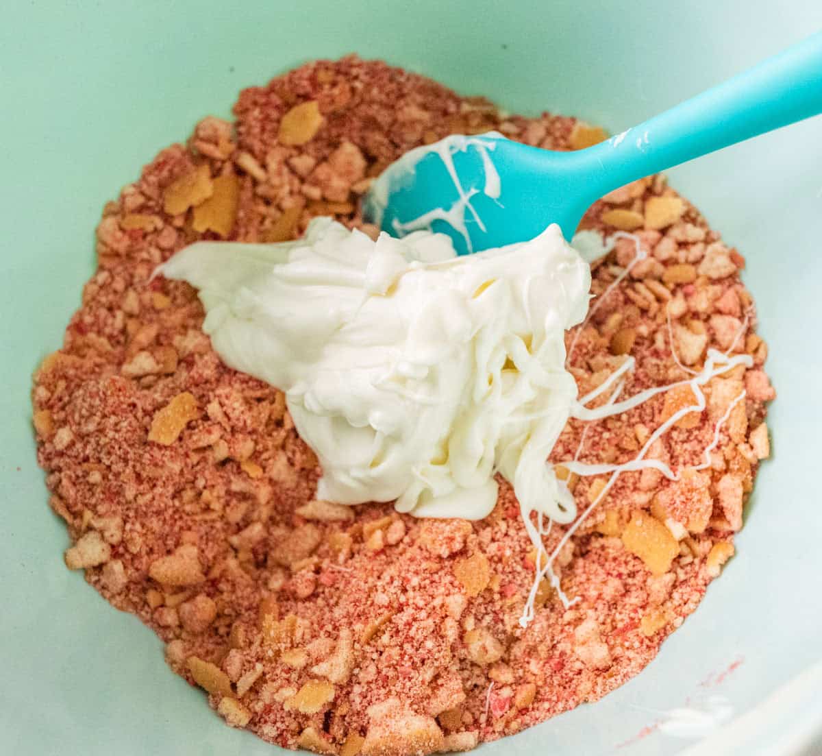 Strawberry Crunch Cake | thewendthousekitchen.com Melted white chocolate chips added to vanilla wafers and strawberry powder.