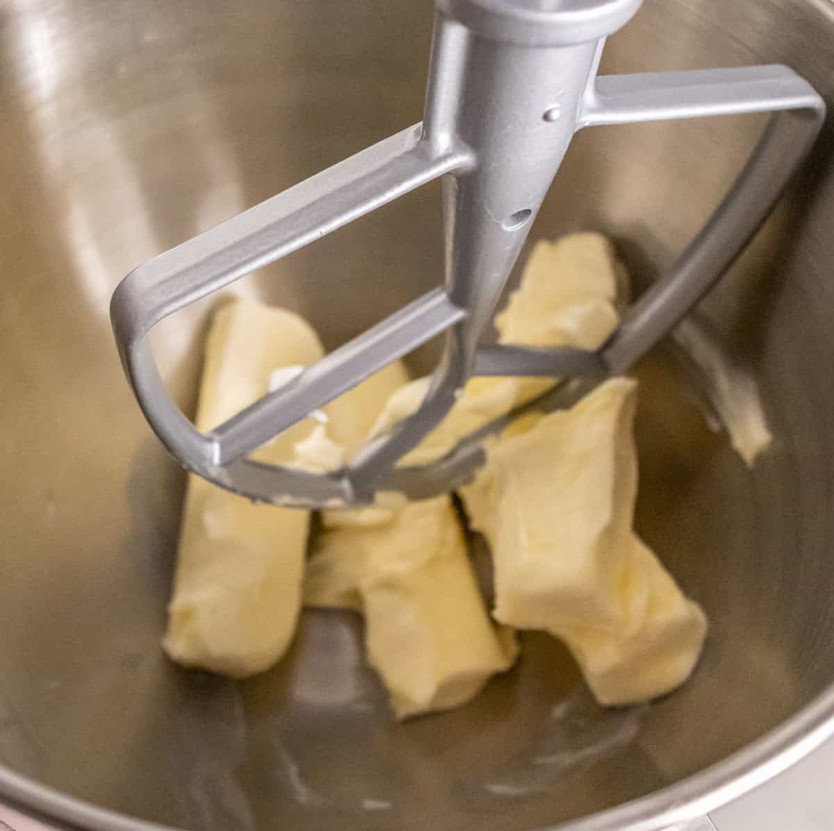 Strawberry Crunch Cake | thewendthousekitchen.com Softened butter in the bowl of a stand mixer with a paddle attachment.